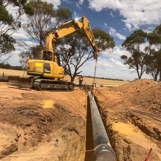 Trenching and pipe installation for farm infrastructure